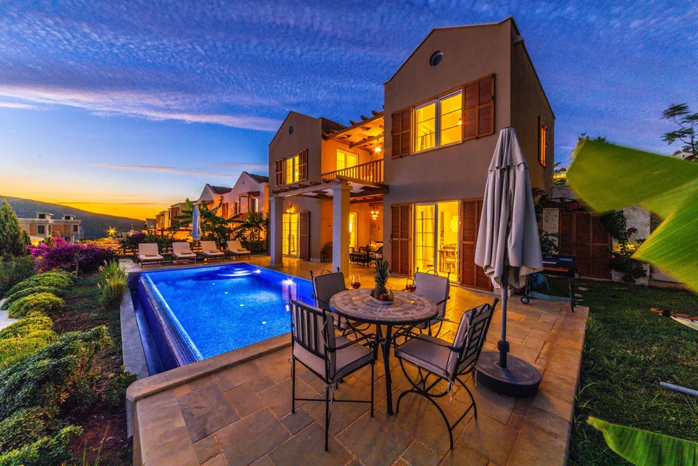 Villa with a private pool in Kalkan at dusk